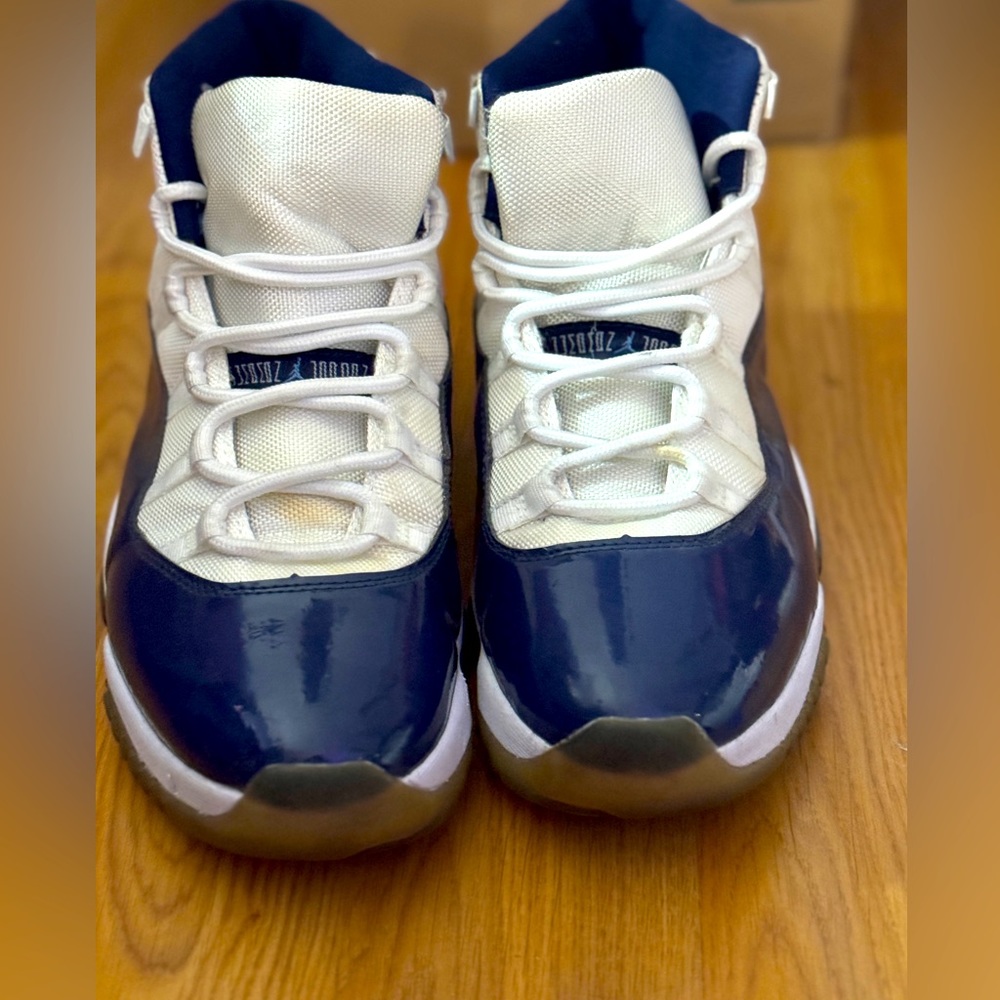 Like new air jordan 11 retro win like 82 high tops. Blue and white size 12